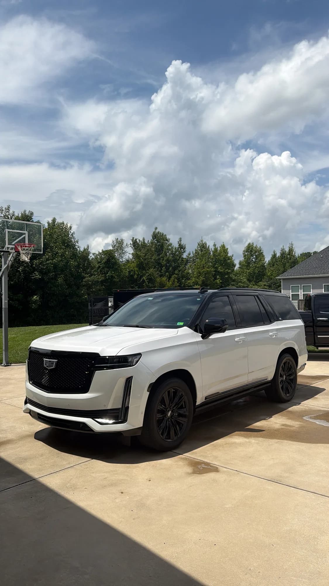A finished Cadillac Escalade Sport on a residential Chesapeake driveway