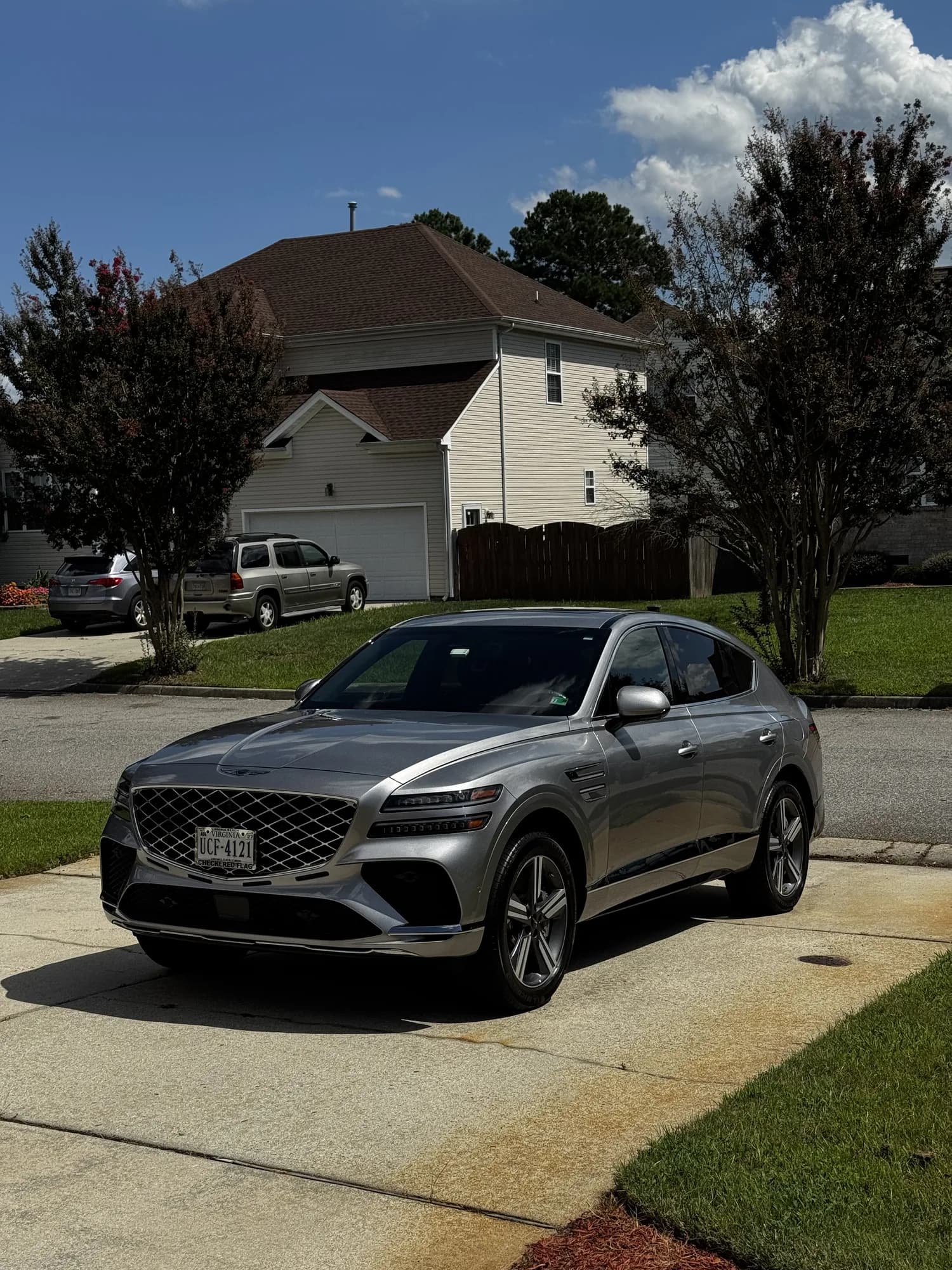 A finished Genesis GV80 Coupe on a suburban Virginia Beach driveway